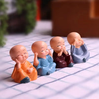 Mini Buddha Monk Statues Set of 4  – Peaceful Decorative Showpieces for Home, Car Dashboard & Gifting