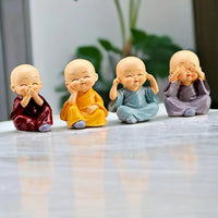 Mini Buddha Monk Statues Set of 4  – Peaceful Decorative Showpieces for Home, Car Dashboard & Gifting